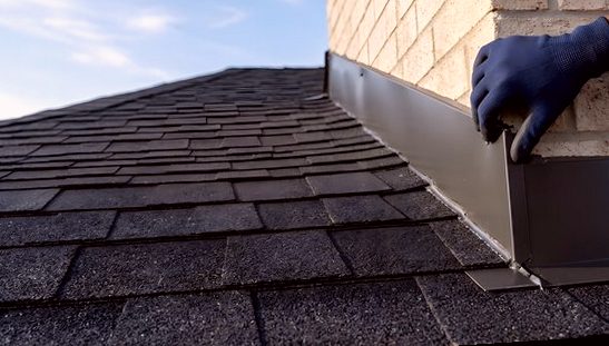 New flashing line pressed into position against light brick